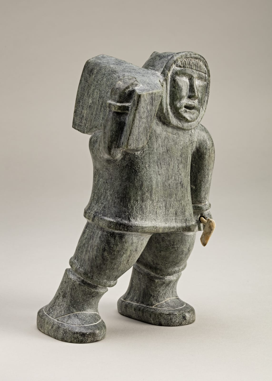 SOLOMONIE TIGULLARAQ (1924-2000) Kangiqtugaapik (Clyde River), Hunter with Ice Block and Axe, c. 1967