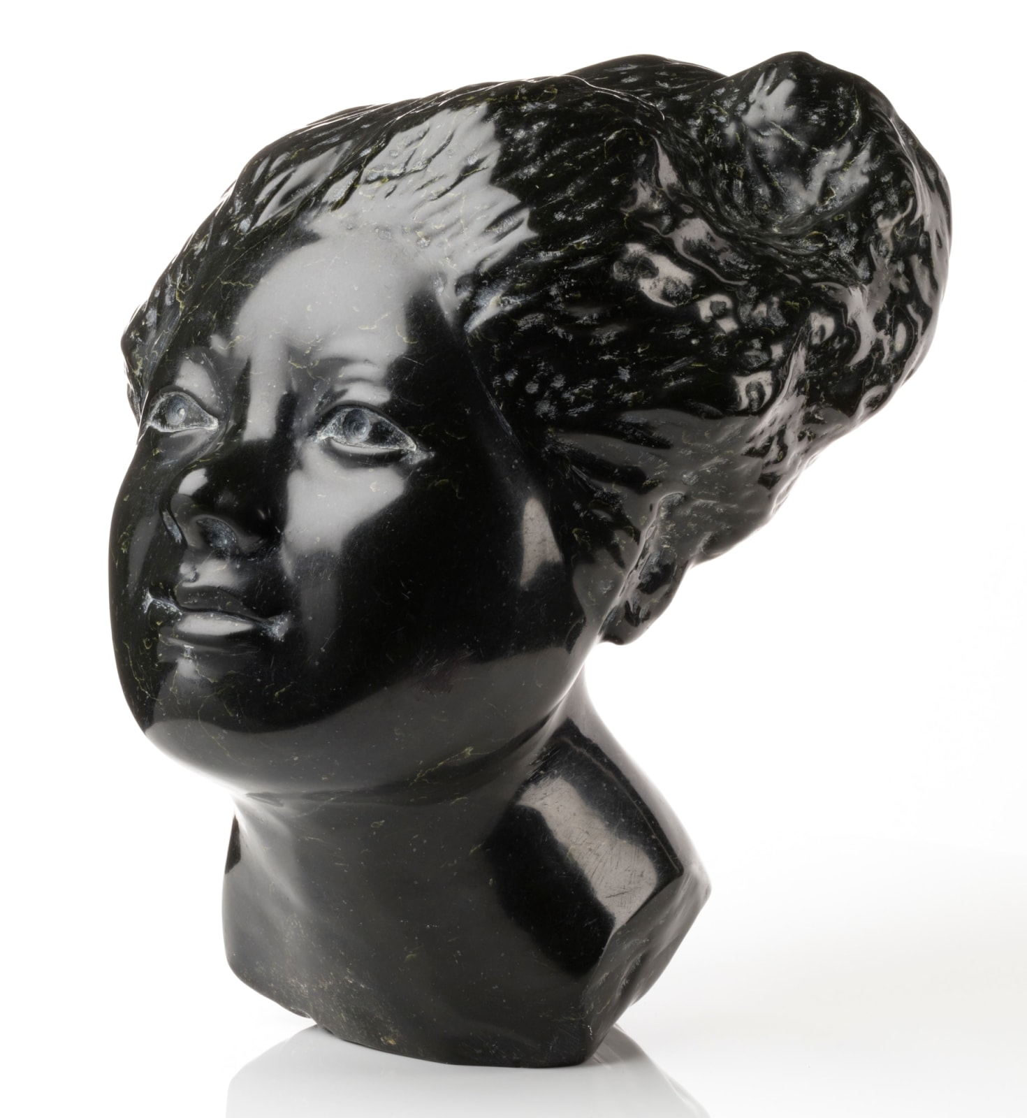 HENRY EVALUARDJUK (1923-2007) IQALUIT (FROBISHER BAY), Head of an Woman with Billowing Hair, 1975