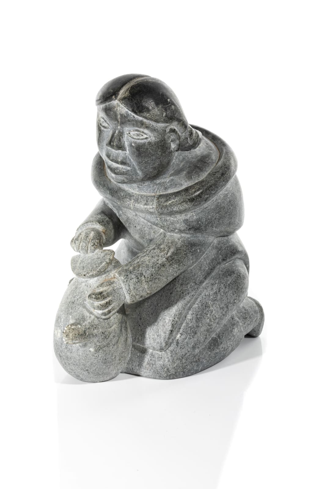SARAH MEEKO NASTAPOKA (1925-) INUKJUAK (PORT HARRISON), A Kneeling Woman Preparing a Skin