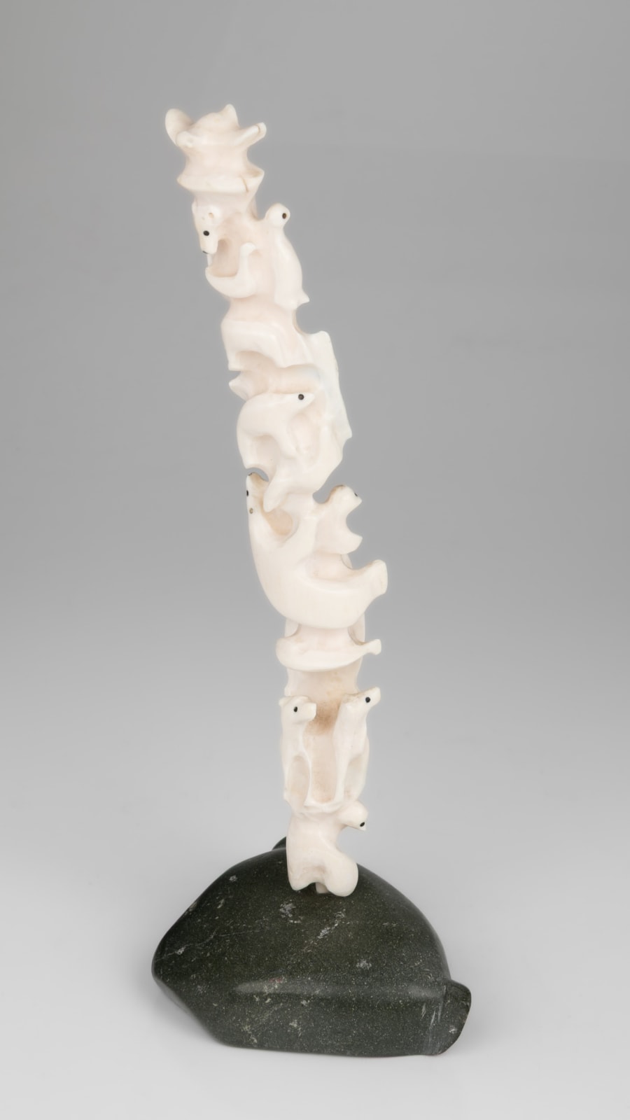 BERNADETTE IVALOOARJUK SAUMIK (1938-) NAUJAAT (REPULSE BAY) / RANKIN INLET (KANGIQLINIQ), Totemic Composition with Inuit and Owls on Seal Base, 1977