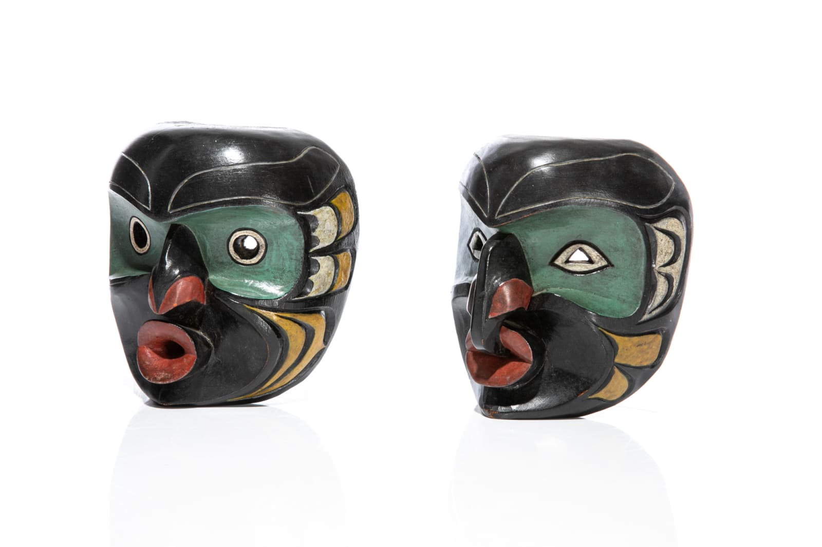 LLOYD WADHAMS SR. (1938-1992) TLAWITSIS (KALUGWIS), Wild Woman ( (Dzoonakwa) and Man Masks, late 1960s