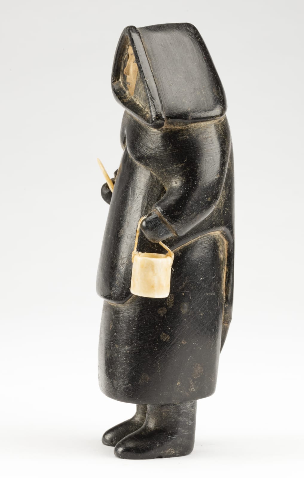 UNIDENTIFIED ARTIST, PROBABLY INUKJUAK (PORT HARRISON), Standing Woman with Pail and Ulu, c. 1949-50