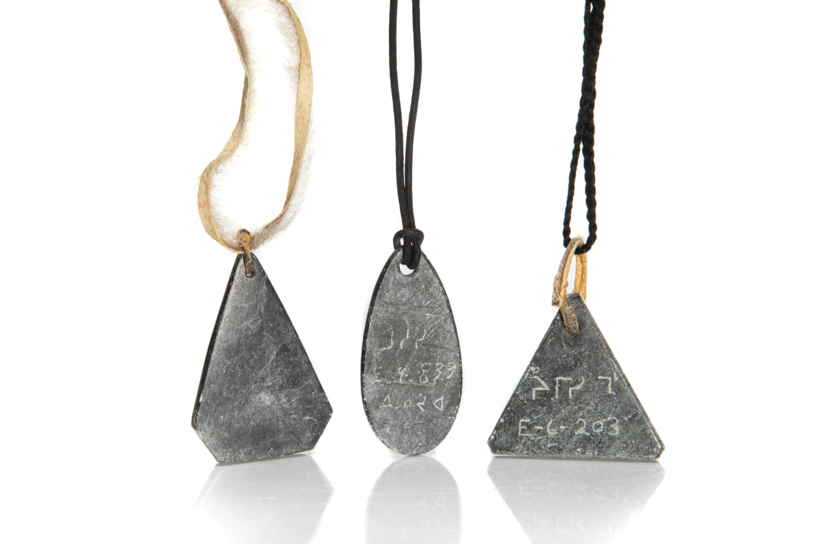 JAMASIE MIKE (1928-) PANNIRTUQ (PANGNIRTUNG), MOSES AUPALUKTIK (1924-1983) PUVIRNITUQ (POVUNGNITUK), and JOSEPHEE KILABUK (1934-) PANNIRTUQ (PANGNIRTUNG), Three Pendants , mid-late 1960s & 1968