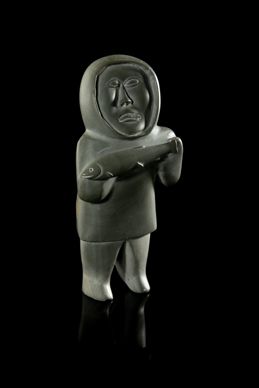 UNIDENTIFIED ARTIST, possibly SANIKILUAQ (BELCHER ISLAND), Standing Hunter with Caught Fish, 1960s