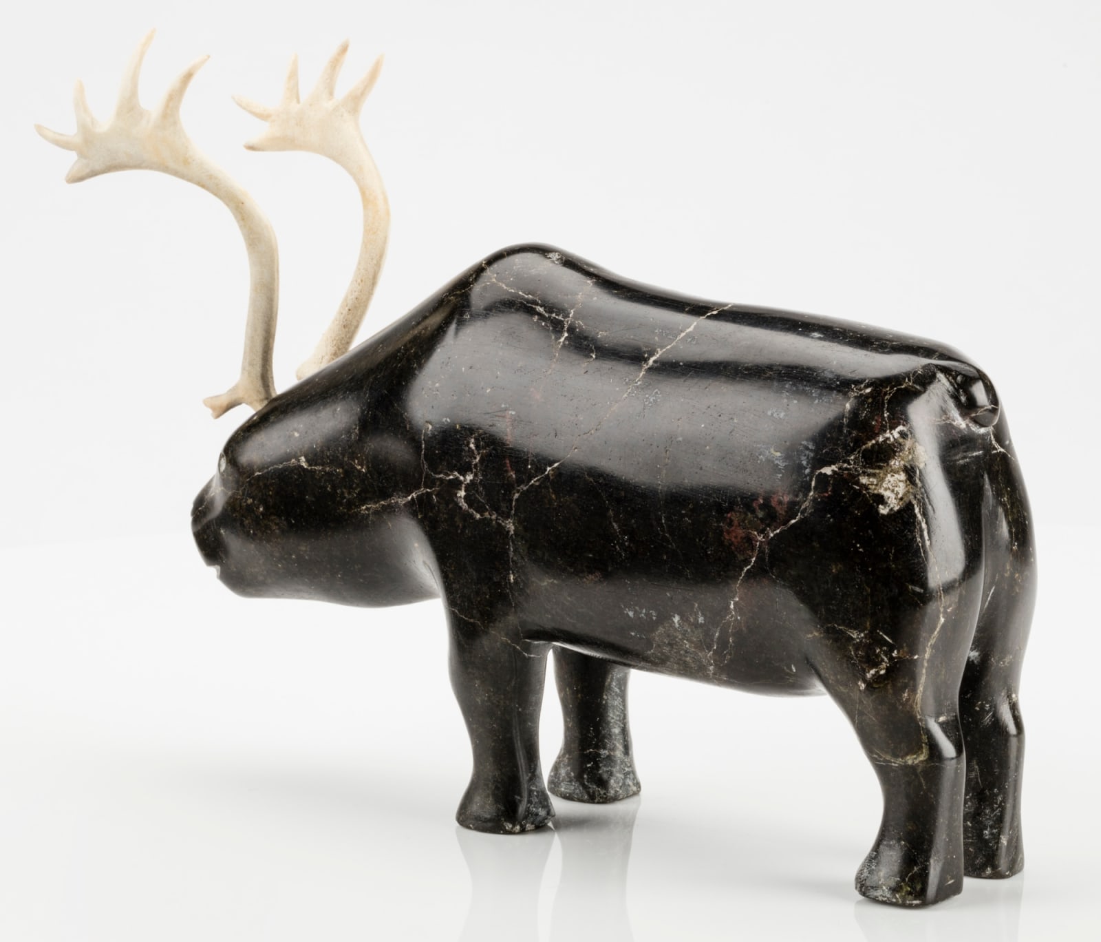 MARK TUNGILIK (1913-1986) NAUJAAT (REPULSE BAY), Standing Caribou, c. mid to late 1970s