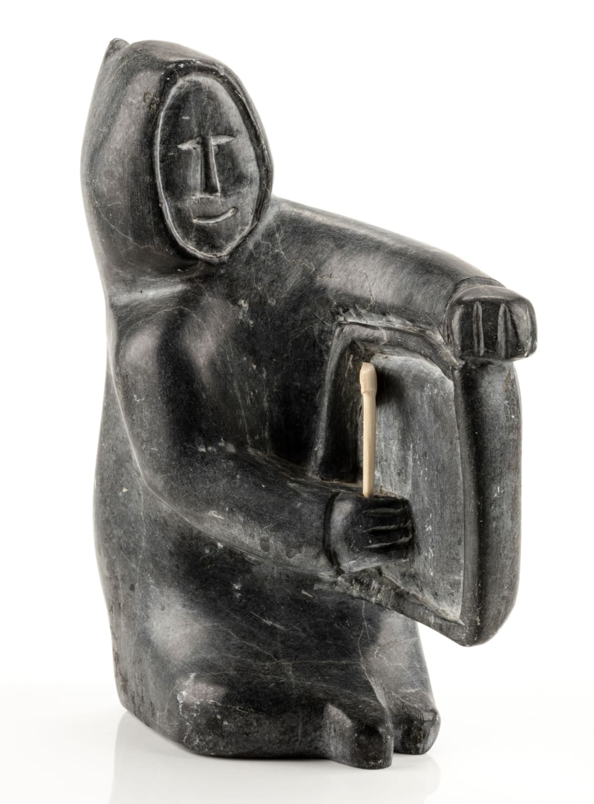 JOHN ATTOK (1906-1980) ARVIAT (ESKIMO POINT), Man Carving a Soap Dish, c. 1965-70