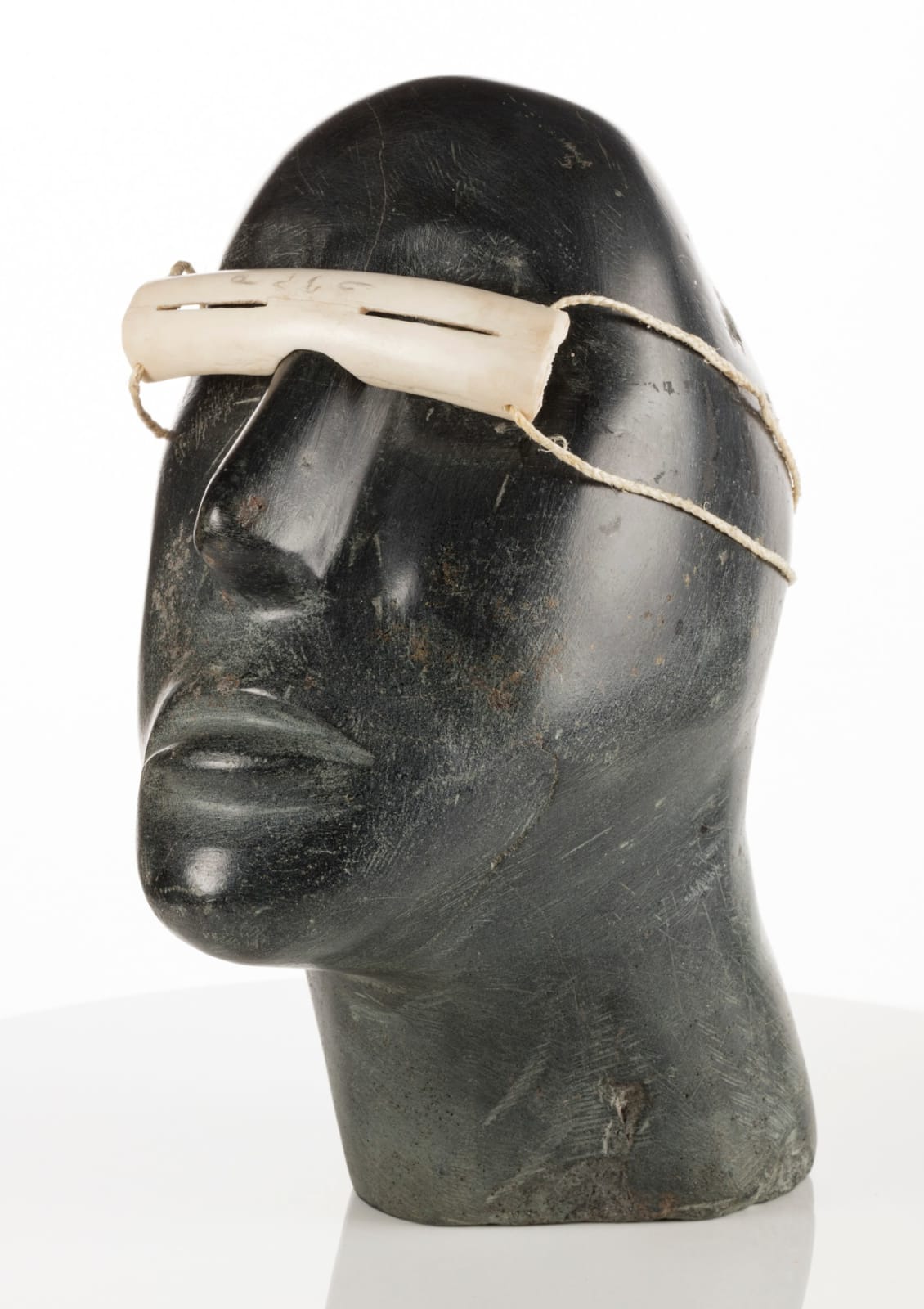 MOSES NAGYUGALIK (1910-1996) QAMANI’TUAQ (BAKER LAKE), Head of a Man Wearing Snow Goggles, 1968