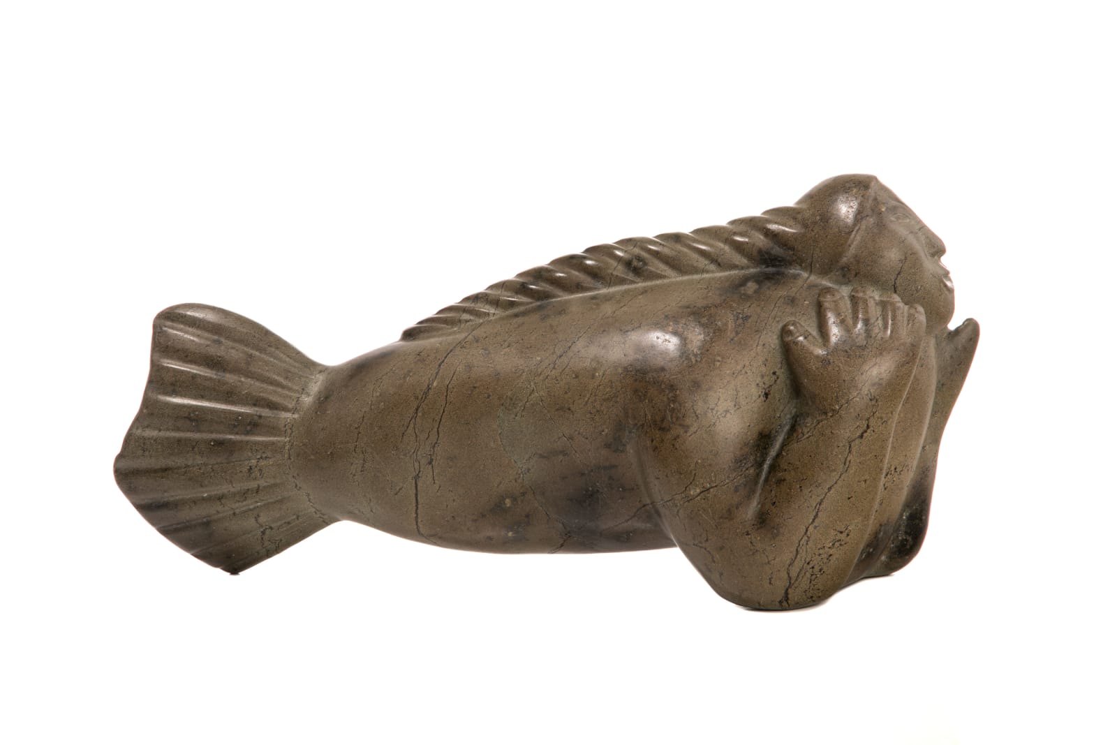 Attributed to: KENOJUAK ASHEVAK, C.C., R.C.A. (1927-2013) KINNGAIT (CAPE DORSET), Swimming Sedna with Plaited Hair, early-mid 1970s