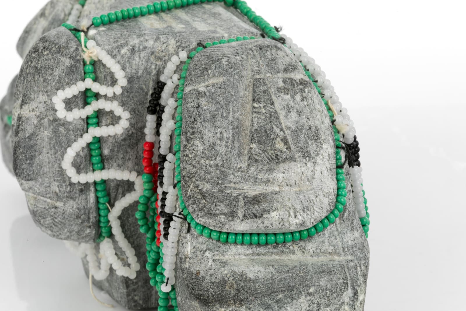 EVA TALOOKI ALIKTILUK (1927-1994) ARVIAT (ESKIMO POINT), Three Women in Beaded Amautiq Hoods