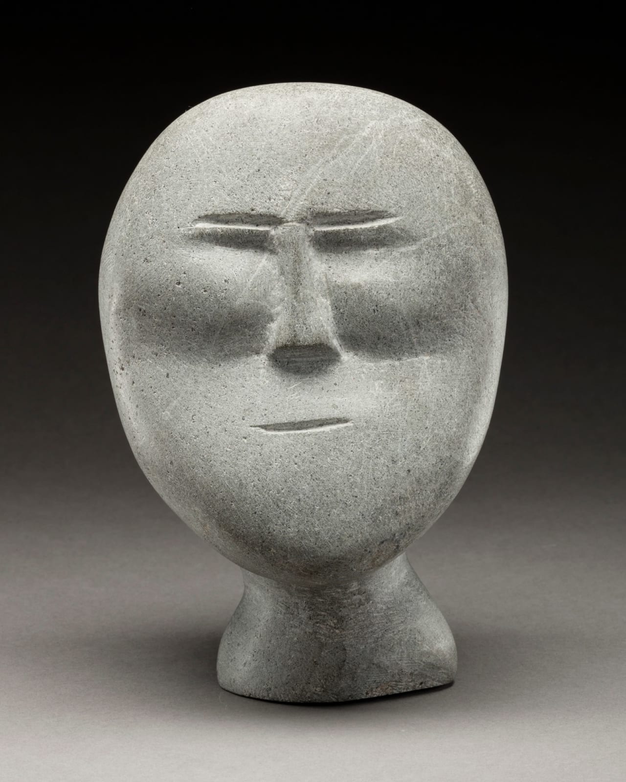 JOHN TIKTAK, R.C.A. (1916-1981) KANGIQLINIQ (RANKIN INLET), Head, c. 1964-65