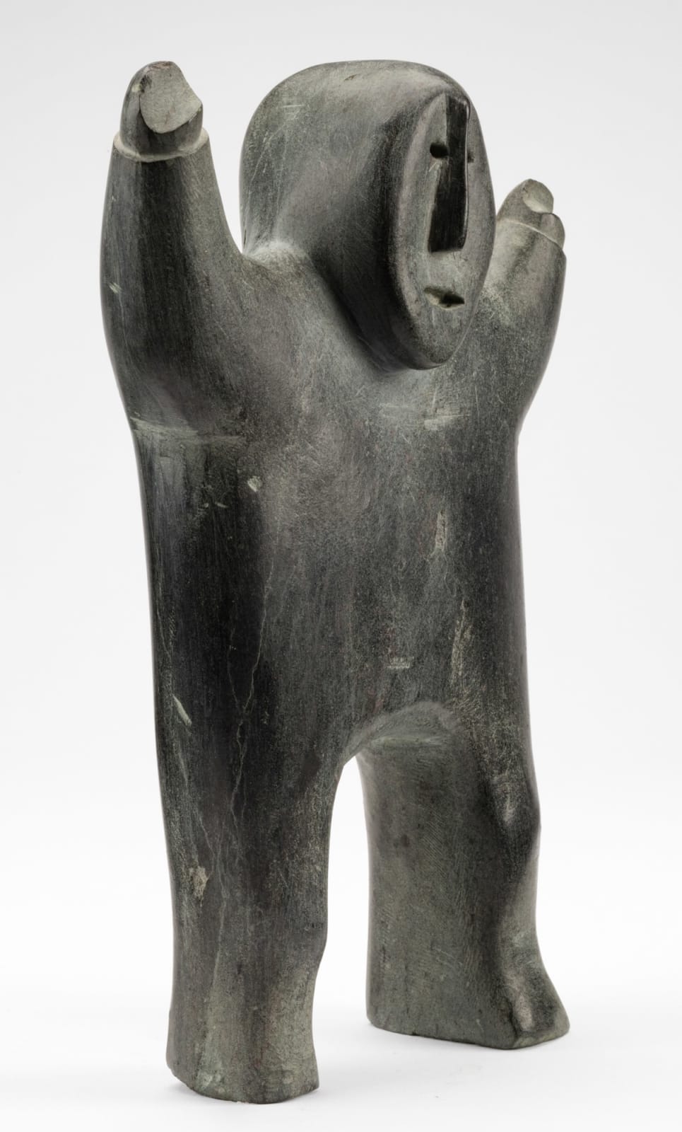 PETER INUKSHUK (1896-1975) QAMANI’TUAQ (BAKER LAKE), Man Signalling Caribou Sighting, c. 1970