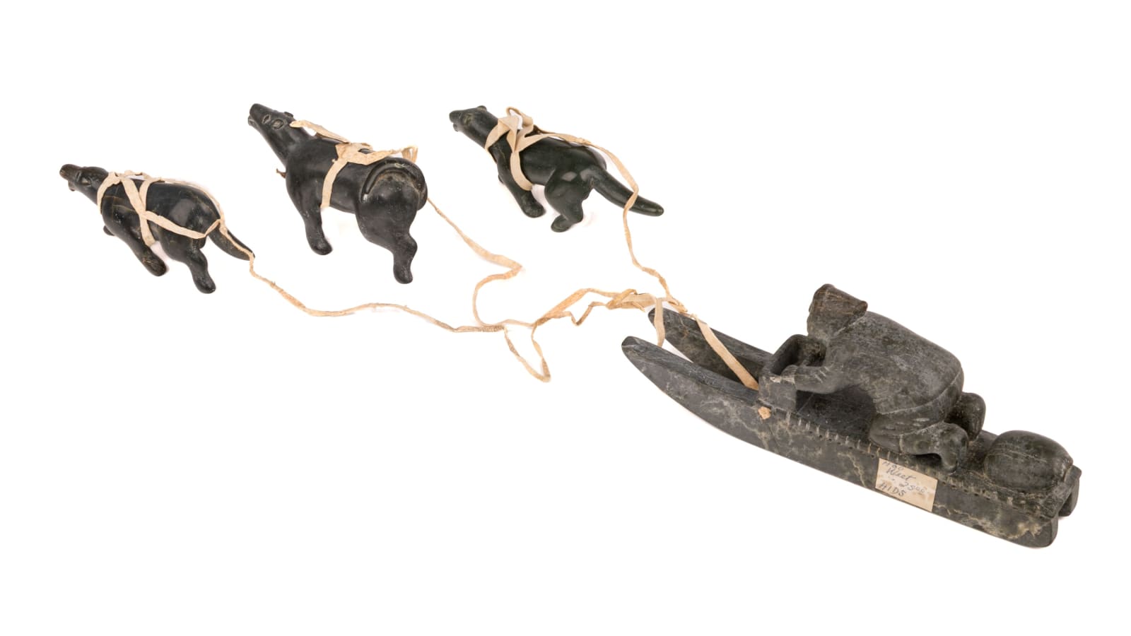 DANIEL OWEETALUKTUK (1934-D?) INUKJUAK (PORT HARRISON), Man on Qamutiik (Komatik) with Three Sled Dogs, c. 1960s