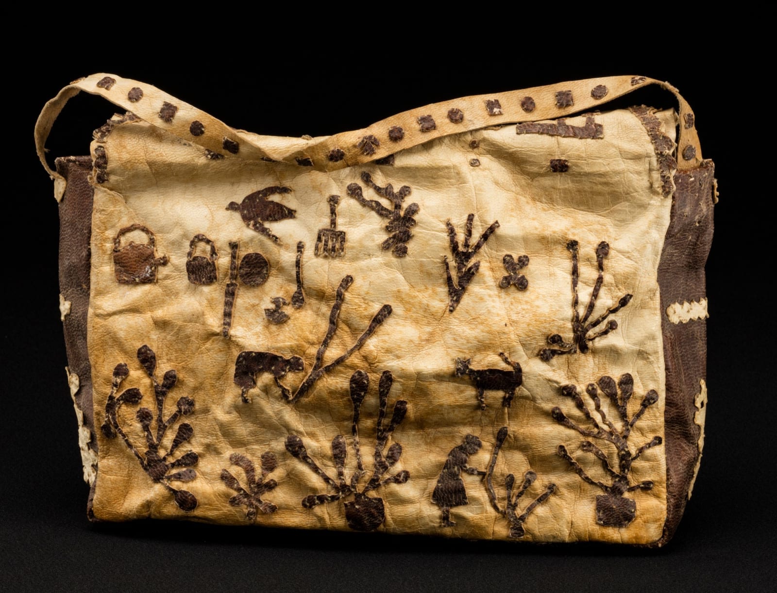 KENOJUAK ASHEVAK, C.C., R.C.A. (1927-2013) KINNGAIT (CAPE DORSET), Sealskin Handbag, c. 1956-57