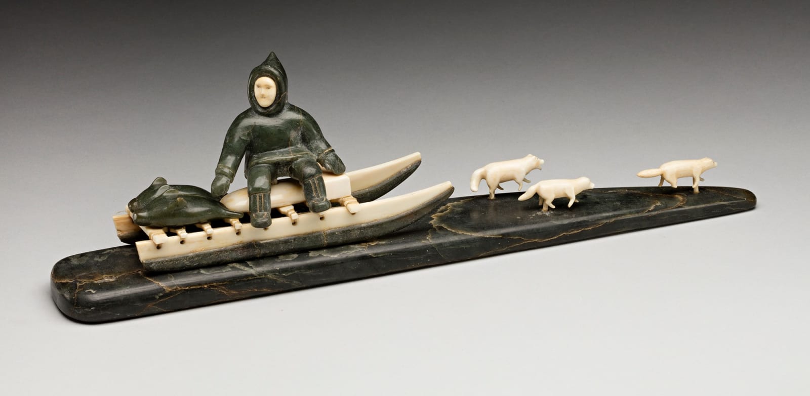 UNIDENTIFIED ARTIST, INUKJUAK (PORT HARRISON), Hunter Seated on a Qamutiq (Dog Sled), early-mid 1950s