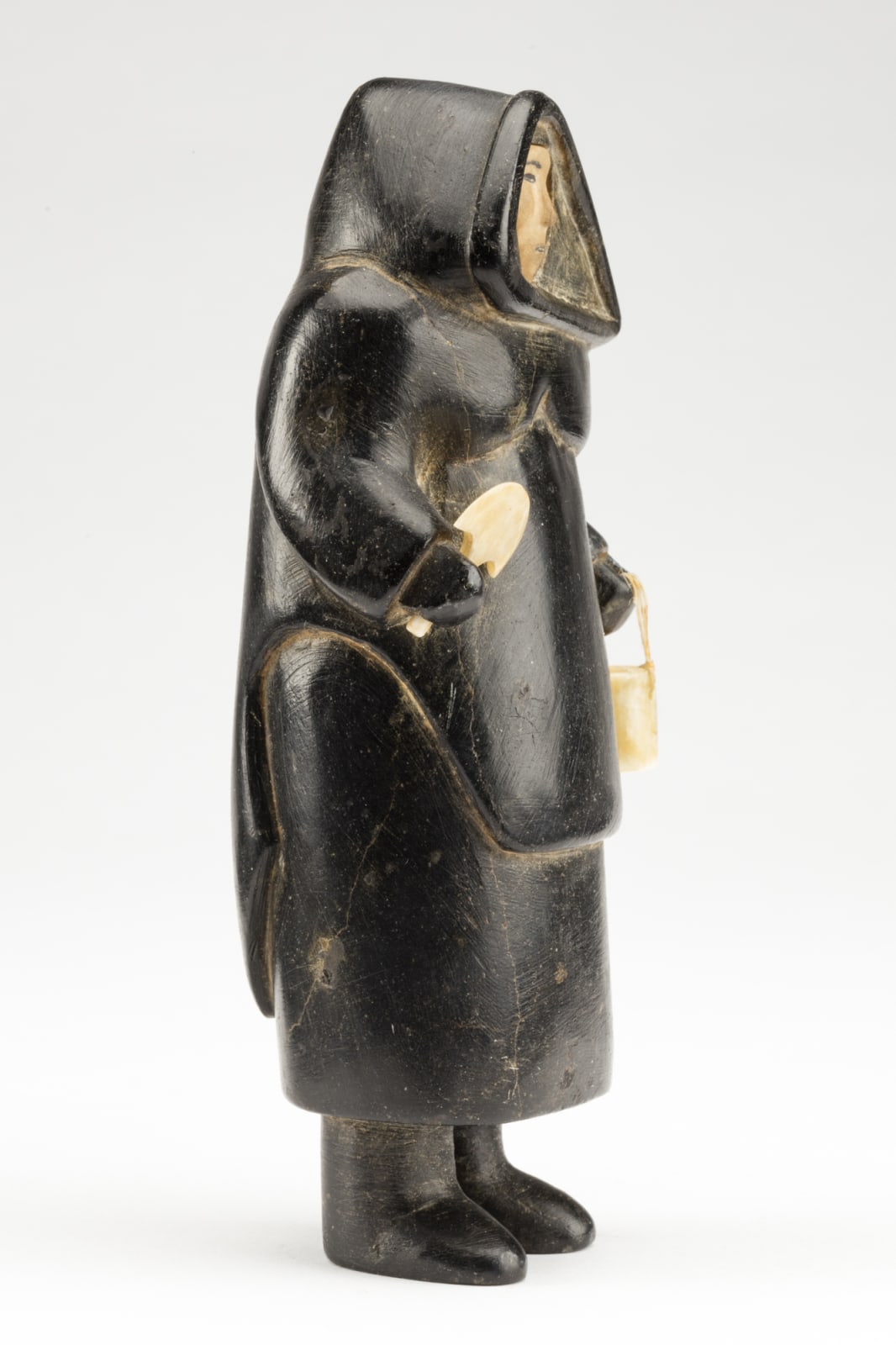 UNIDENTIFIED ARTIST, PROBABLY INUKJUAK (PORT HARRISON), Standing Woman with Pail and Ulu, c. 1949-50