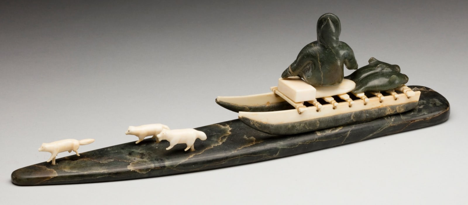 UNIDENTIFIED ARTIST, INUKJUAK (PORT HARRISON), Hunter Seated on a Qamutiq (Dog Sled), early-mid 1950s