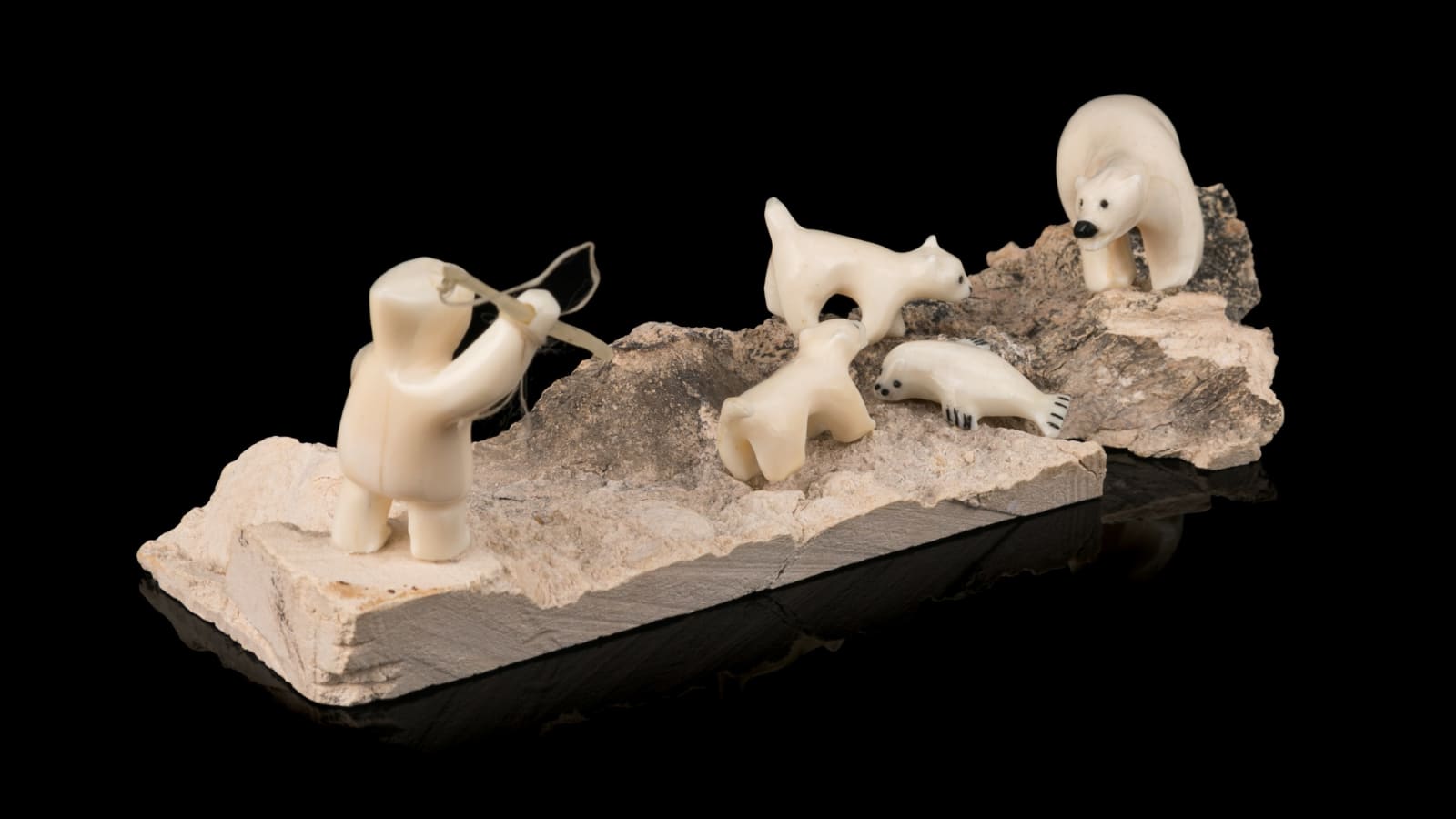 EMILY PANGNERK ILLUITOK (1943-2012) ARVILIQJUAQ (PELLY BAY), First to the Feast: Hunter, Dogs, Polar Bear, and Seal, 1980s