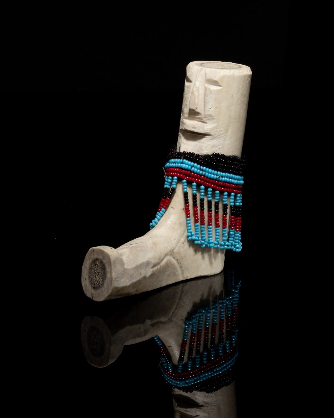 EVA TALOOKI ALIKTILUK (1927-1995) ARVIAT (ESKIMO POINT), Seated Woman in an Amautiq