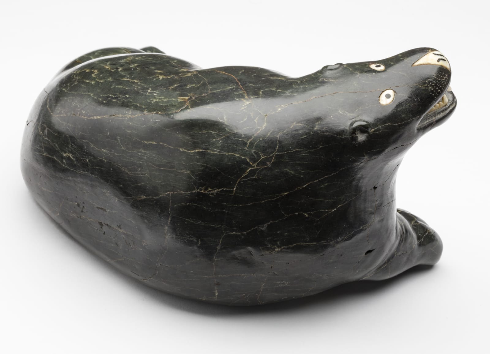 ELIJASSIAPIK (1912-1972) INUKJUAK (PORT HARRISON), Reclining Polar Bear, c. 1955