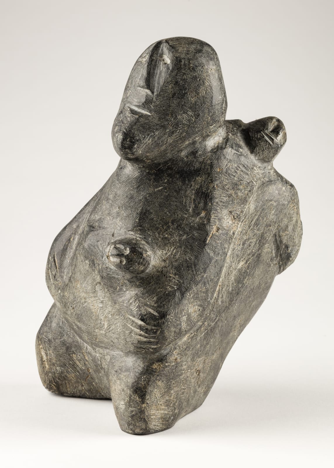 ELIZABETH NUTARAALUK AULATJUT (1914-1998) ARVIAT (ESKIMO POINT), Mother and Child with Fish, c. 1982