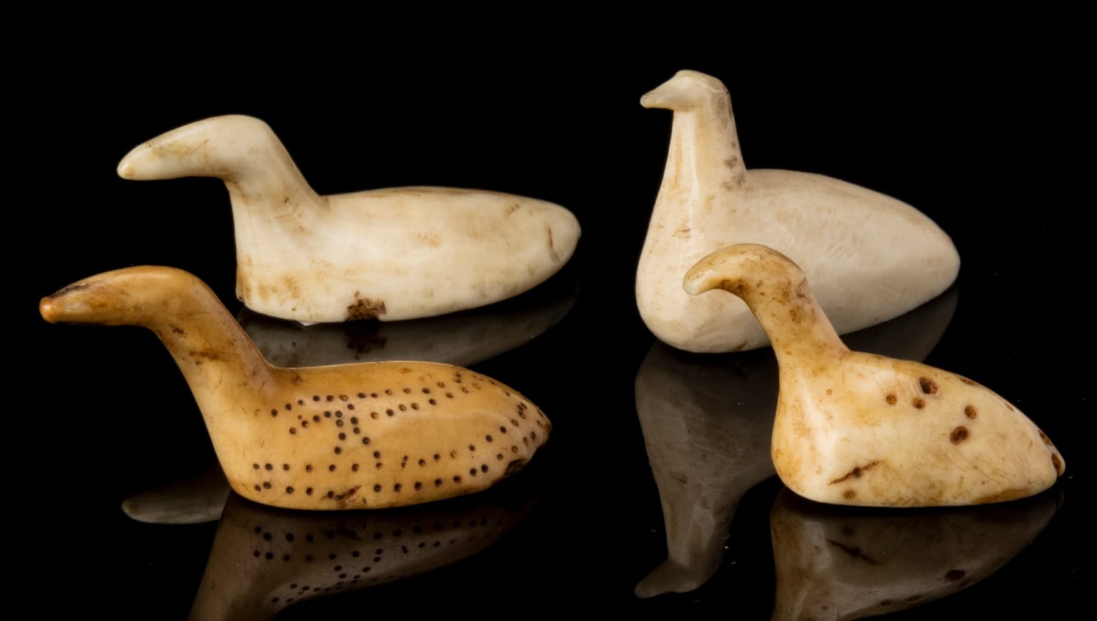 INUIT AND POSSIBLY THULE CULTURE MAKERS, EASTERN CANADIAN ARCTIC, Four Bird Game Pieces, before 1935