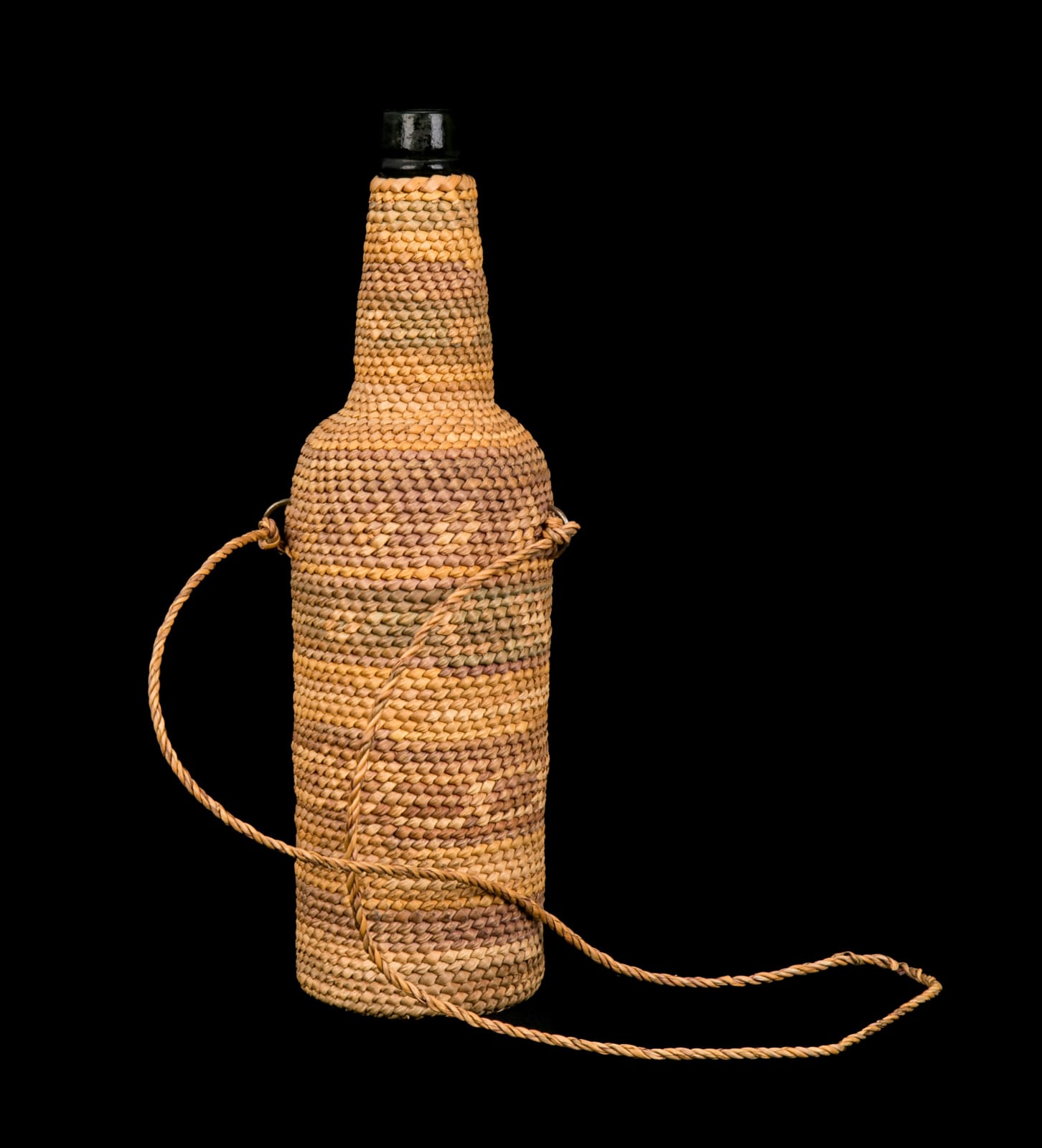UNIDENTIFIED NUU-CHAH-NULTH ARTIST, Wove Basketry Sleeve Covered Bottle , c. 1930s or 1940s