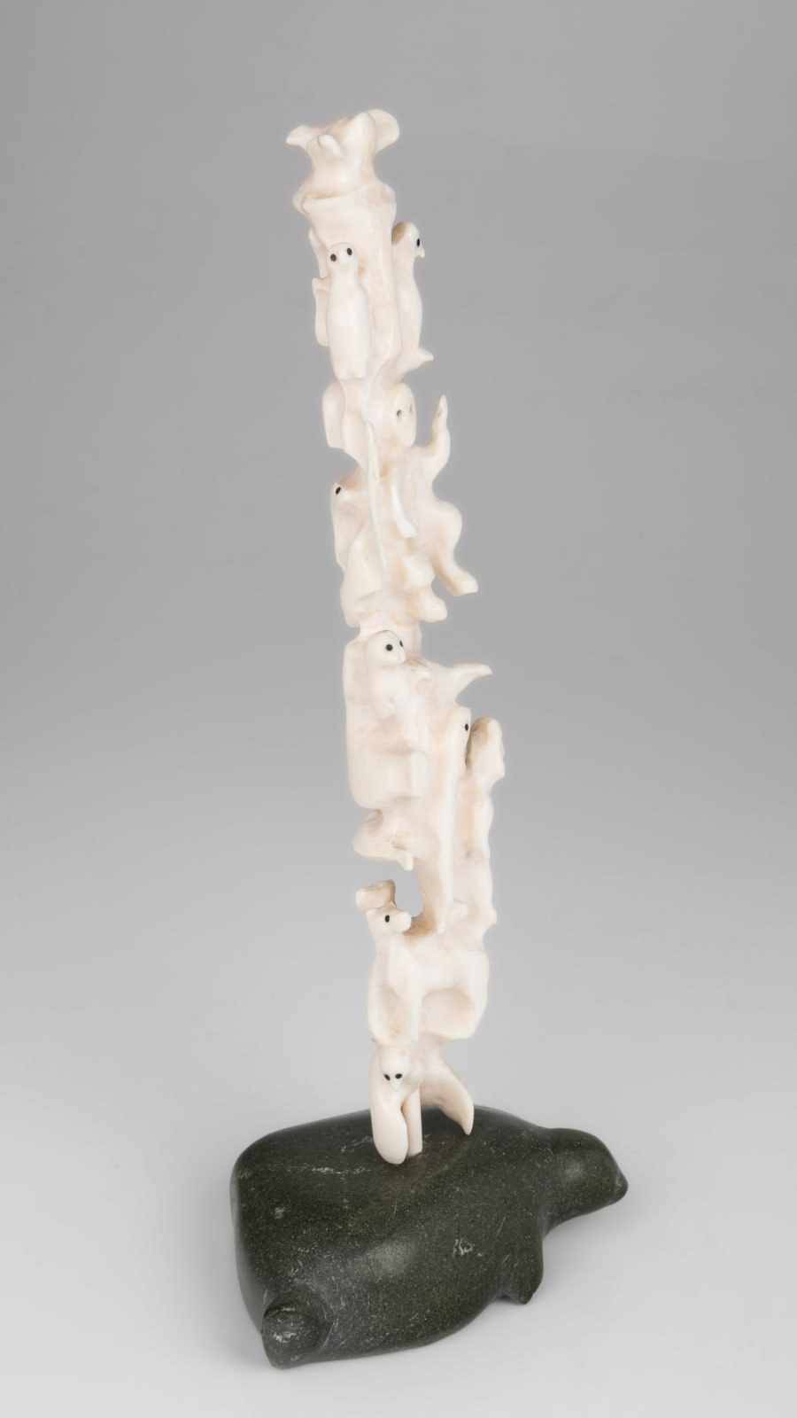 BERNADETTE IVALOOARJUK SAUMIK (1938-) NAUJAAT (REPULSE BAY) / RANKIN INLET (KANGIQLINIQ), Totemic Composition with Inuit and Owls on Seal Base, 1977