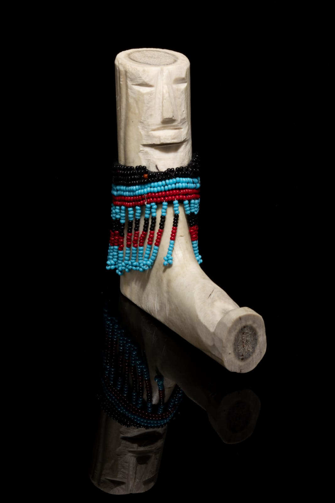 EVA TALOOKI ALIKTILUK (1927-1995) ARVIAT (ESKIMO POINT), Seated Woman in an Amautiq