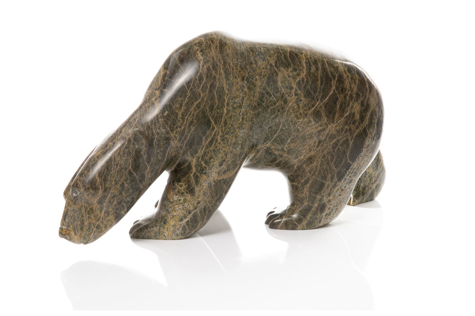 ASHEVAK TUNNILLIE (1956-2018) KINNGAIT (CAPE DORSET), Polar Bear Following a Scent