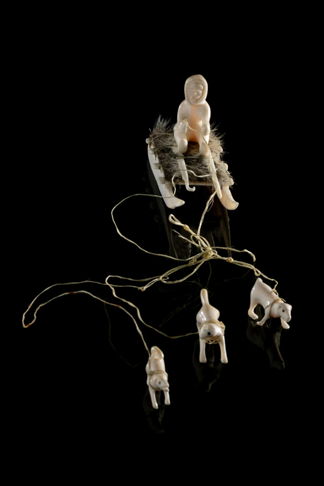 UNIDENTIFIED INUIT ARTIST, EASTERN CANADIAN ARCTIC, Hunter on Qamutiq (Sled) with Qimmiit (Sled Dogs), c. 1980