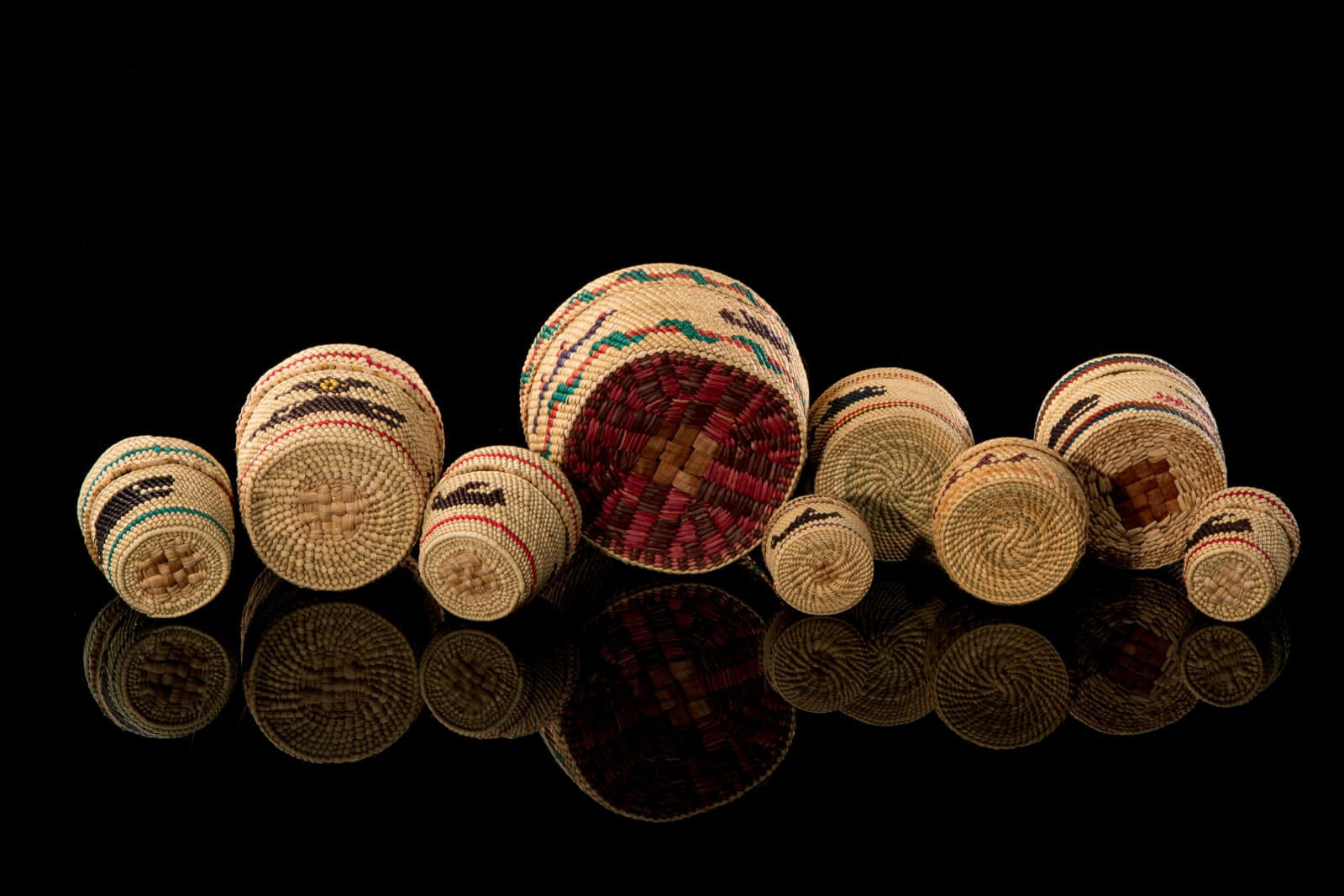 UNIDENTIFIED NUU-CHAH-NULTH ARTISTS, Group of Nine Lidded Pictorial Baskets, mid 1980s or later