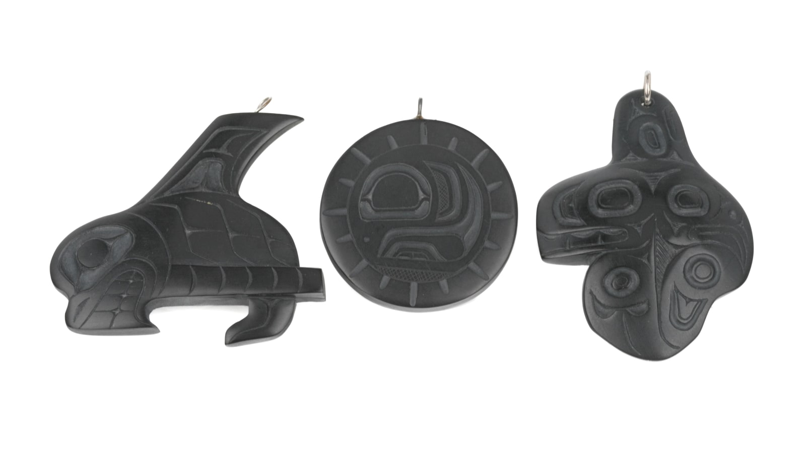 CALVIN BELL (1950-), HAIDA, MASSET / RICHARD SILAS YELTATZIE (1955-1974) HAIDA / PAT DIXON (1938-2015) HAIDA, Three Pendants, c. 2000s / Jan 1974 / Oct 2002