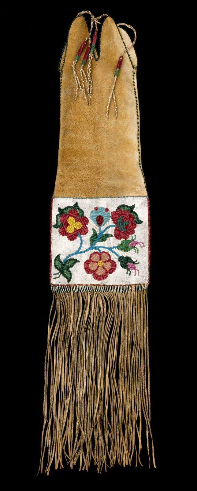 UNIDENTIFIED CREE ARTIST Beaded Pipe Bag, c. 1870 hide, glass beads, and thread, 30 x 6.5 x 2.25 in (76.2 x 16.5 x 5.7 cm)