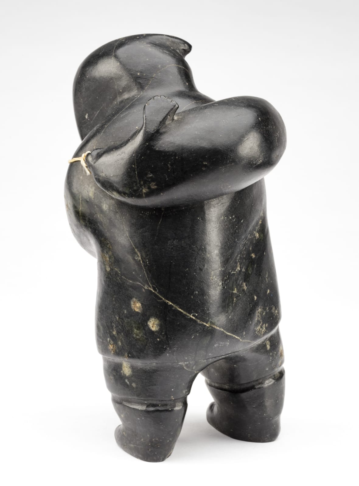 AKEEAKTASHUK (1898-1954) INUKJUAK (PORT HARRISON), Hunter Carrying a Captured Seal, c. 1951-53