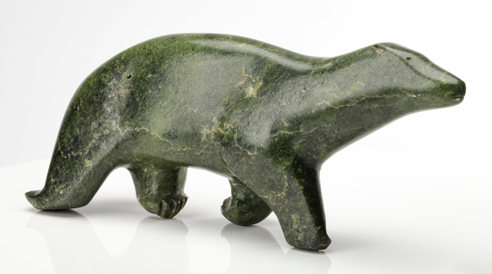 PAUTA SAILA, R.C.A. (1916-2009) KINNGAIT (CAPE DORSET), Striding Polar Bear, c. 1962