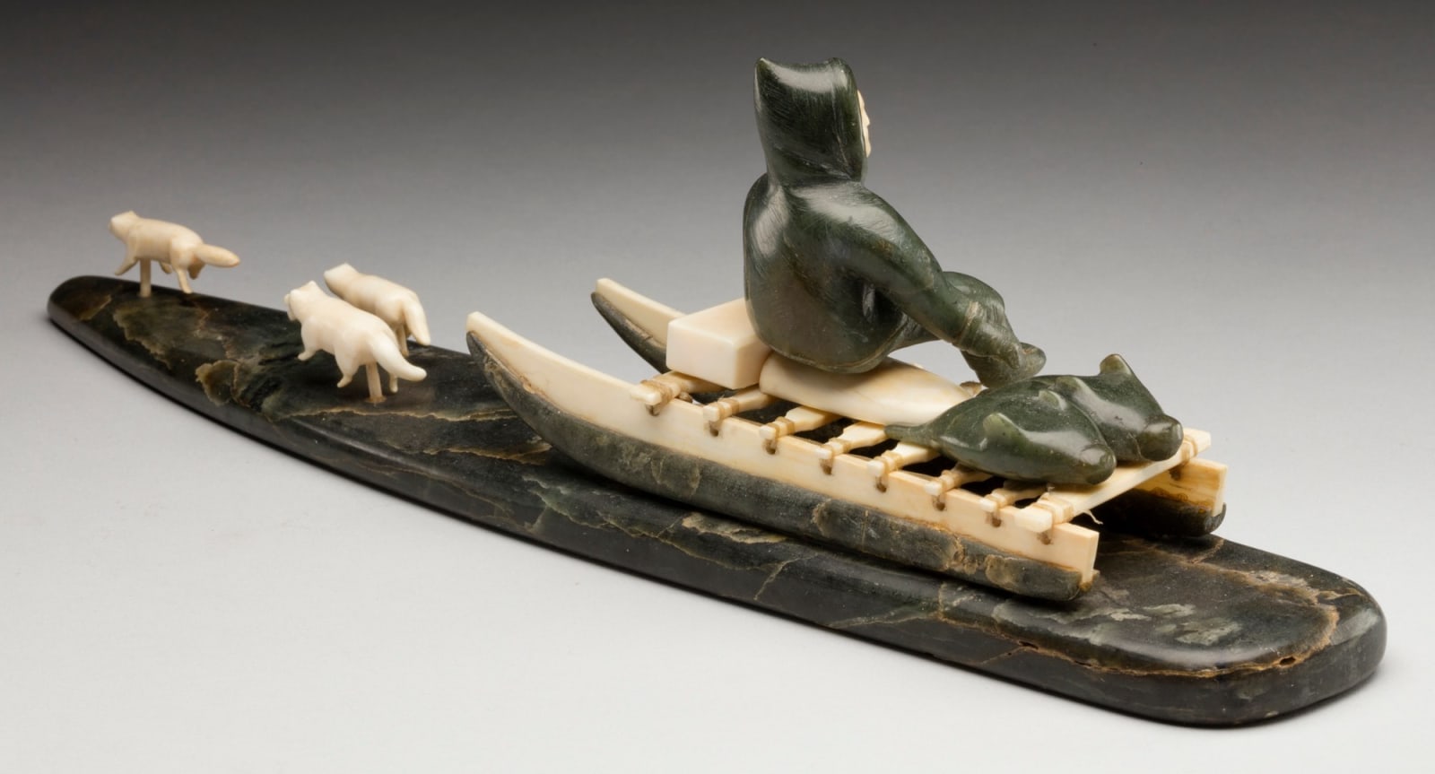 UNIDENTIFIED ARTIST, INUKJUAK (PORT HARRISON), Hunter Seated on a Qamutiq (Dog Sled), early-mid 1950s