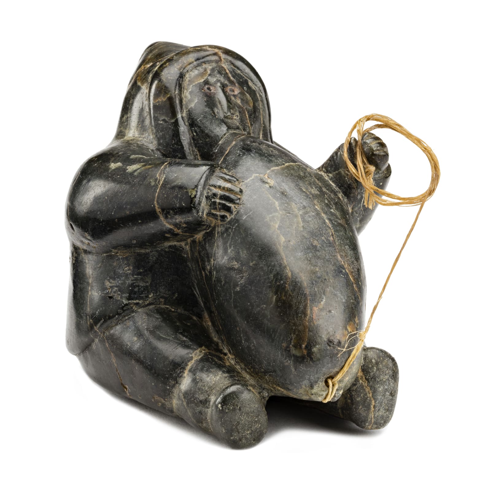 Possibly: ISA OOMAYOUALOOK (1915-1976) PORT HARRISON (INUKJUAK), Man Inflating an Avataq (Seal Skin Float), late 1950s