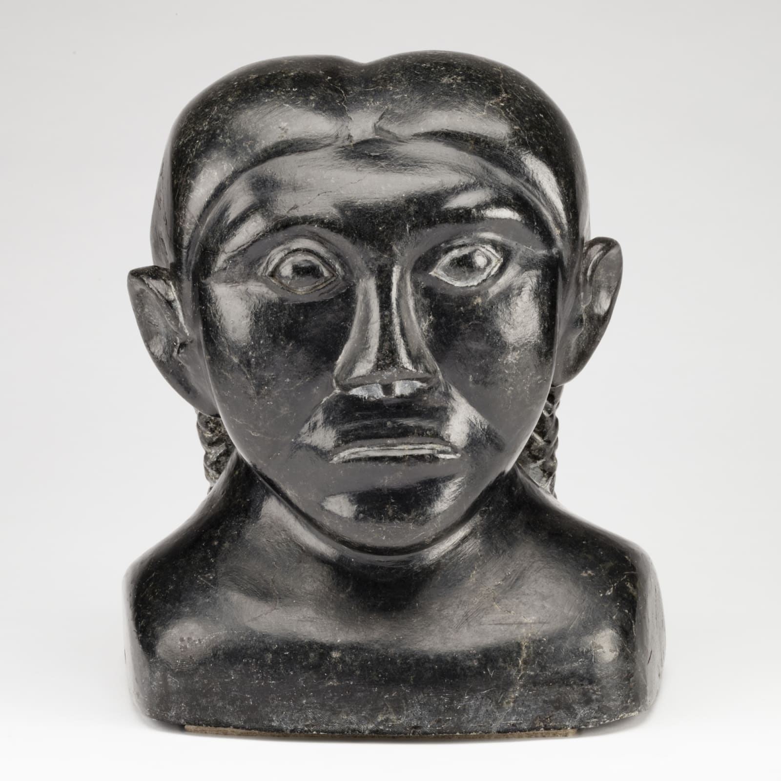 SYOLLIE (SAROLLIE) WEETALUKTUK (1906-1962) m., INUKJUAK (PORT HARRISON), Bust of a Young Woman with Plaited Hair, c. 1960