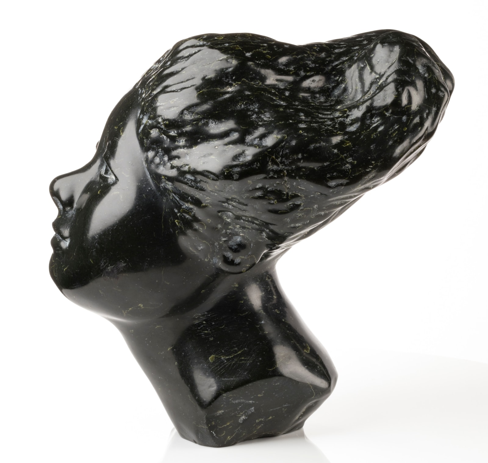 HENRY EVALUARDJUK (1923-2007) IQALUIT (FROBISHER BAY), Head of an Woman with Billowing Hair, 1975