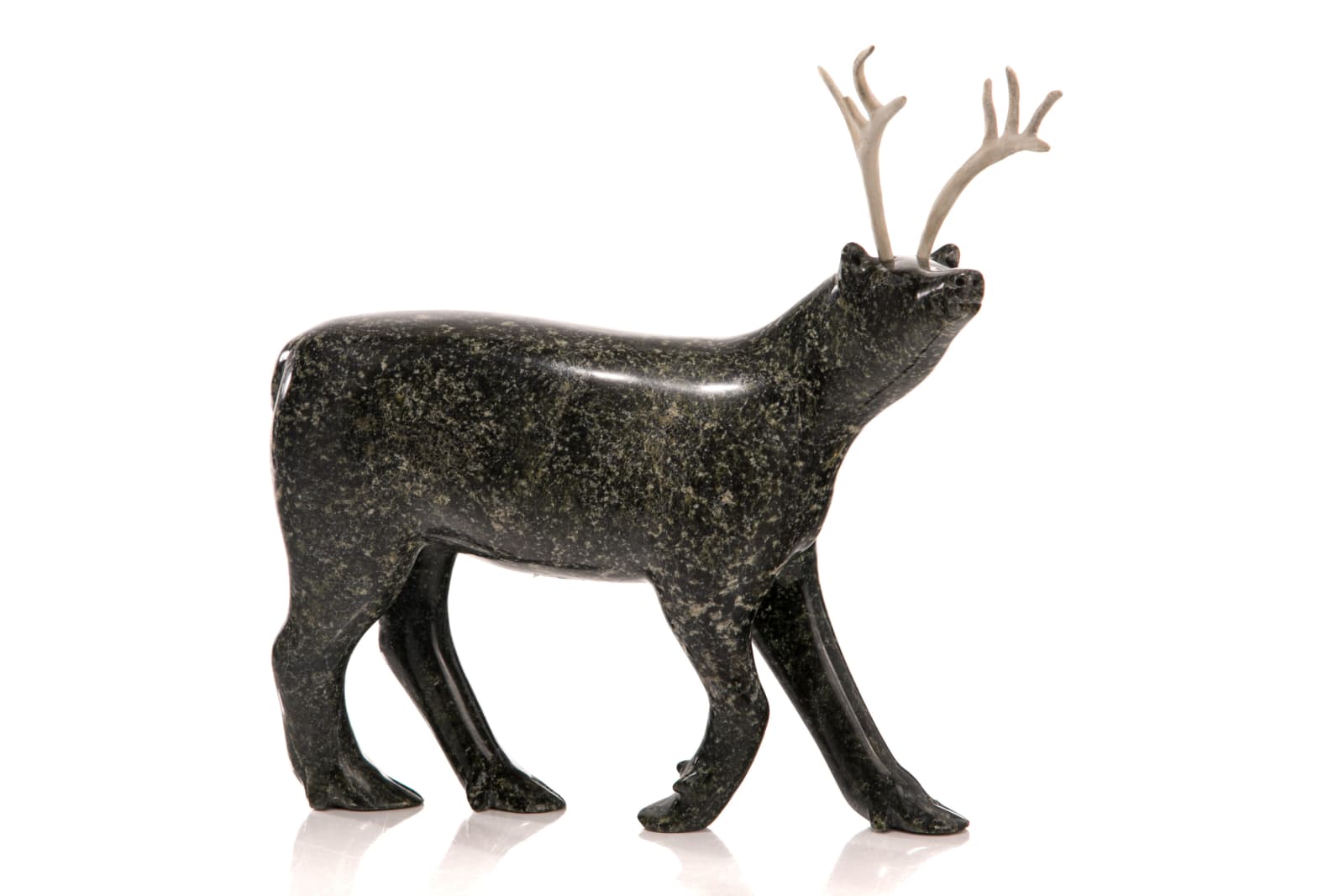 PITSEOLAK NIVIAQSI R.C.A. (1947-2015) KINNGAIT (CAPE DORSET), Strutting Caribou, late 1990s