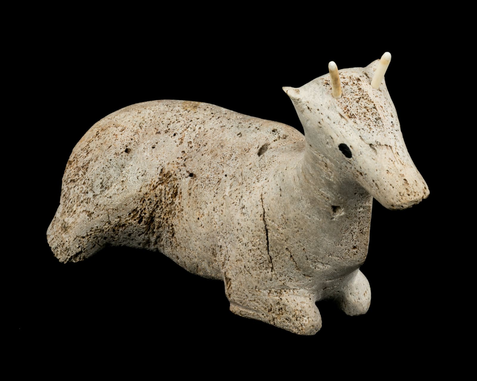 UNIDENTIFIED INUIT ARTIST, POSSIBLY NAUJAAT (REPULSE BAY), Resting Caribou Calf, early 1970s