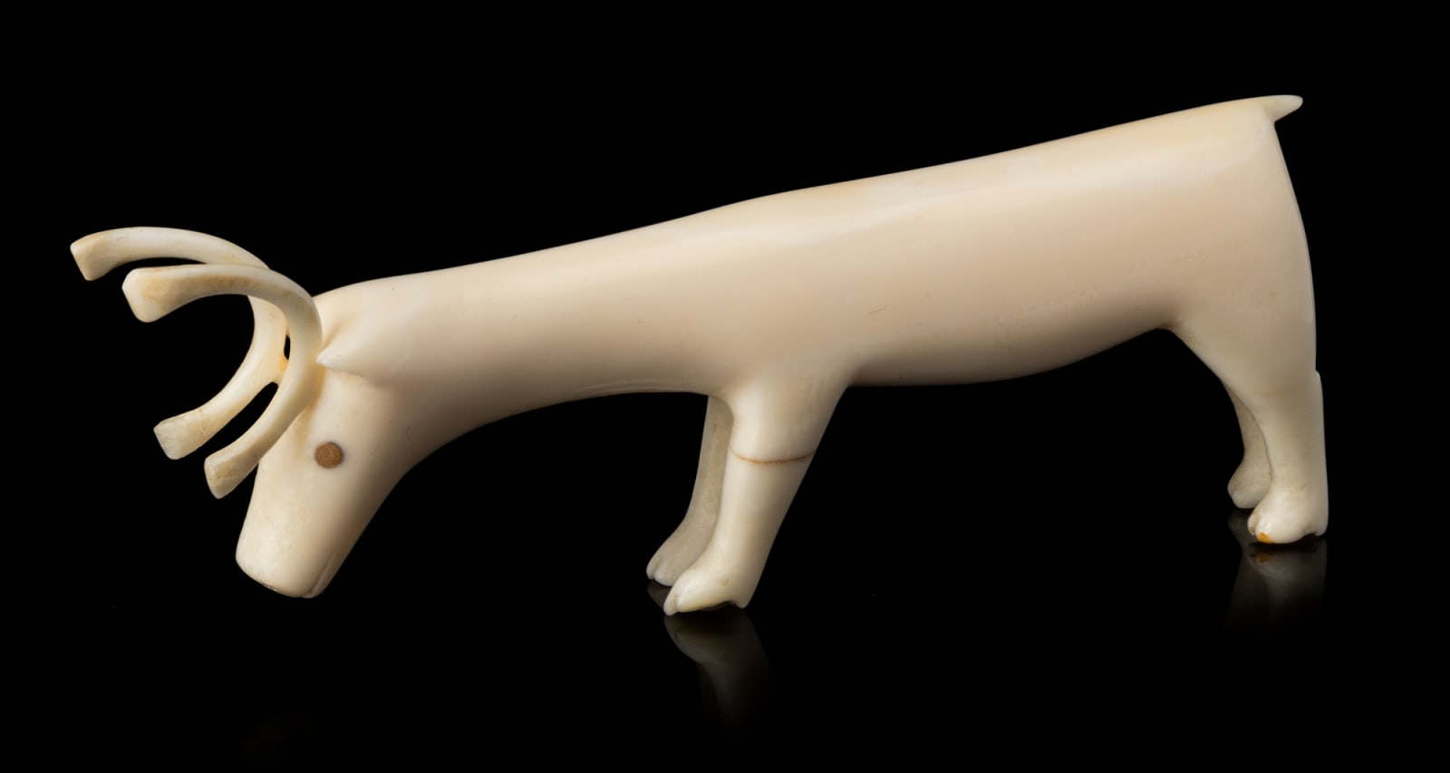 HISTORIC PERIOD INUIT ARTIST, EASTERN CANADIAN ARCTIC, Grazing Caribou, probably 1935 or earlier