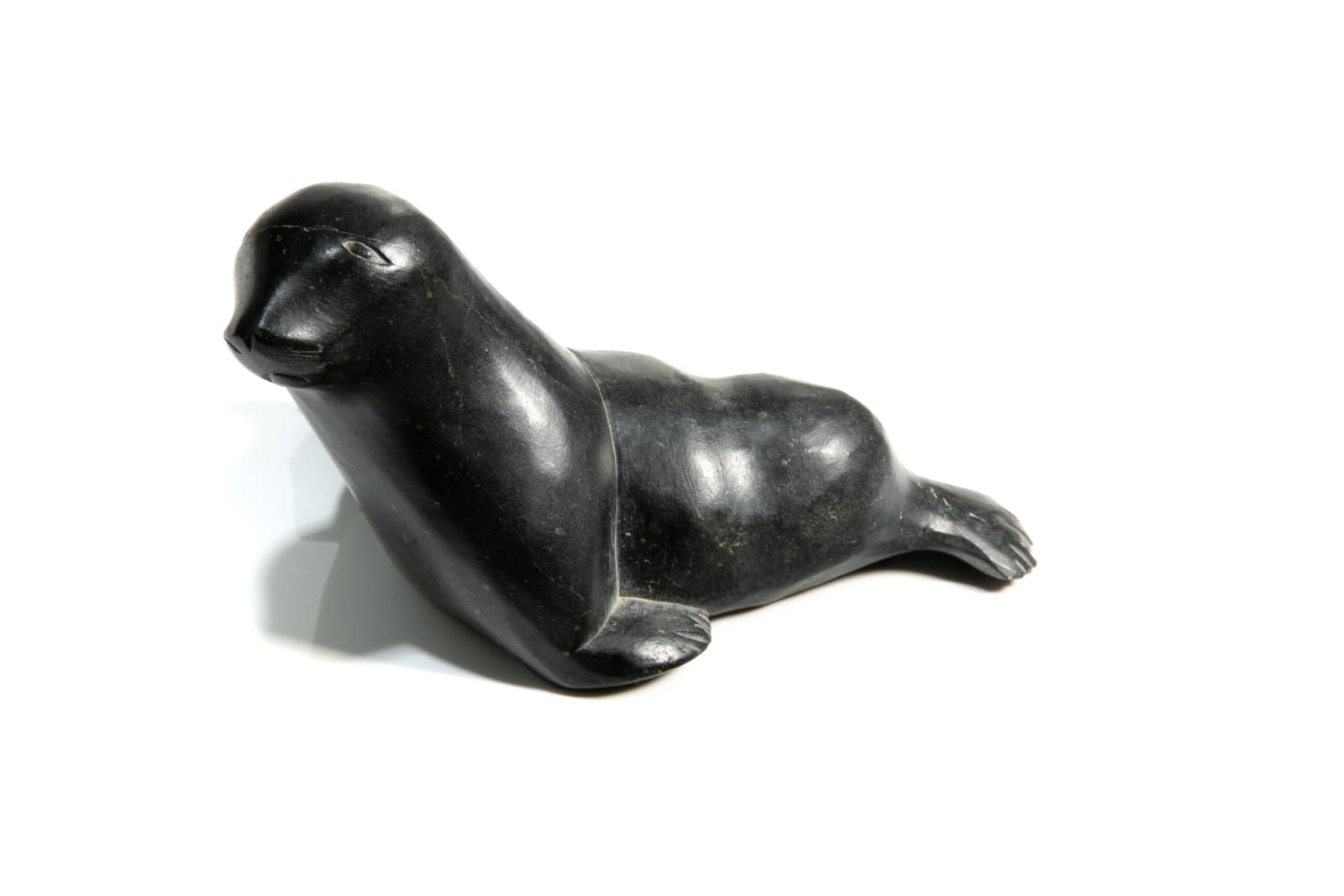 DAVID ARNASUNGAAQ (1964-) QAMANI'TUAQ (BAKER LAKE), Lounging Seal, c. 1990