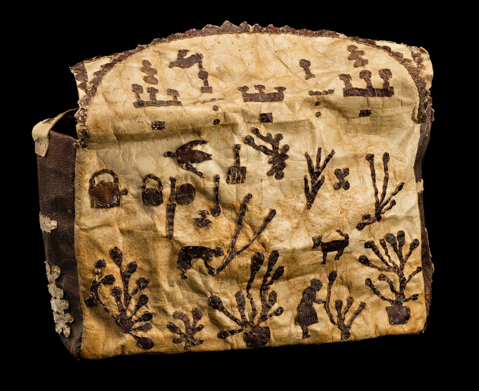 KENOJUAK ASHEVAK, C.C., R.C.A. (1927-2013) KINNGAIT (CAPE DORSET), Sealskin Handbag, c. 1956-57