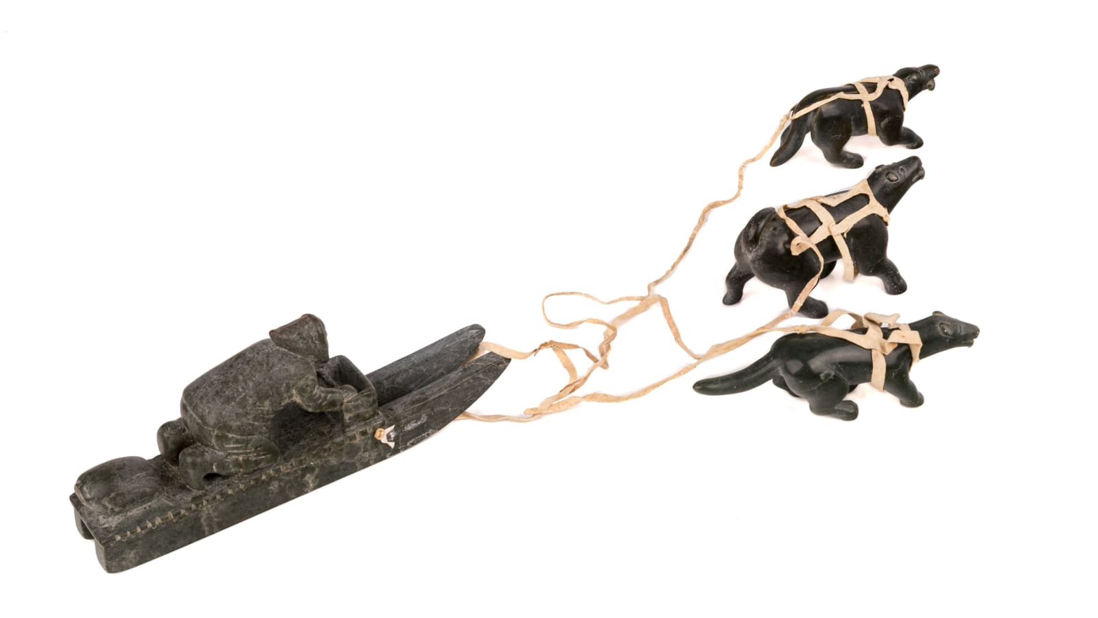 DANIEL OWEETALUKTUK (1934-D?) INUKJUAK (PORT HARRISON), Man on Qamutiik (Komatik) with Three Sled Dogs, c. 1960s