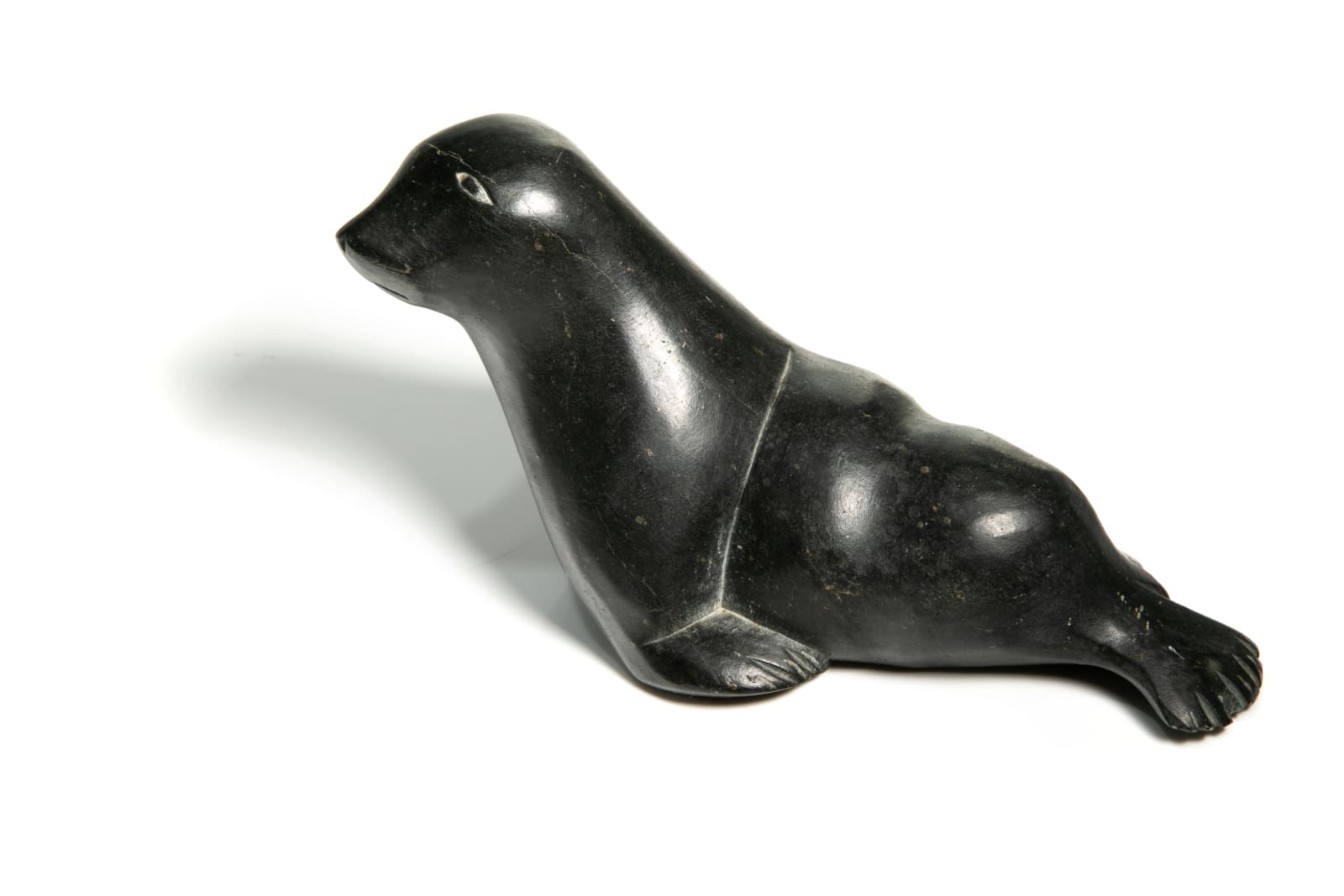 DAVID ARNASUNGAAQ (1964-) QAMANI'TUAQ (BAKER LAKE), Lounging Seal, c. 1990