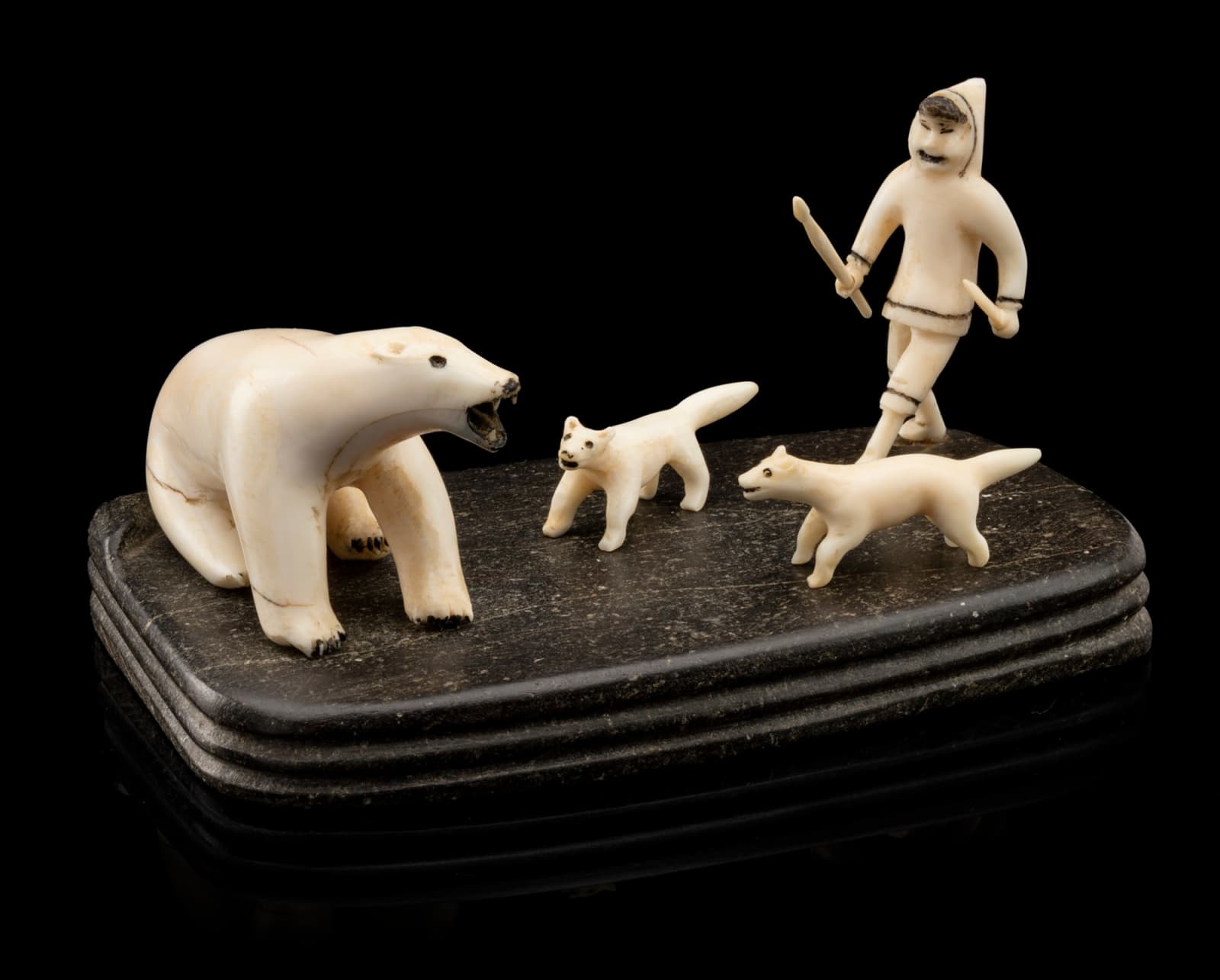 UNIDENTIFIED ARTIST, EASTERN CANADIAN ARCTIC, Hunter and Dogs Approaching a Polar Bear, early 1940s or 1950s