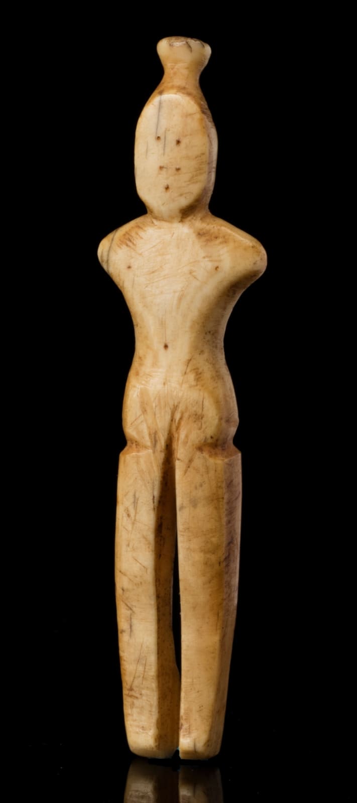 THULE CULTURE OR EARLY HISTORIC PERIOD INUIT ARTIST, POSSIBLY POND INLET AREA, Female Figurine, 19th century or earlier