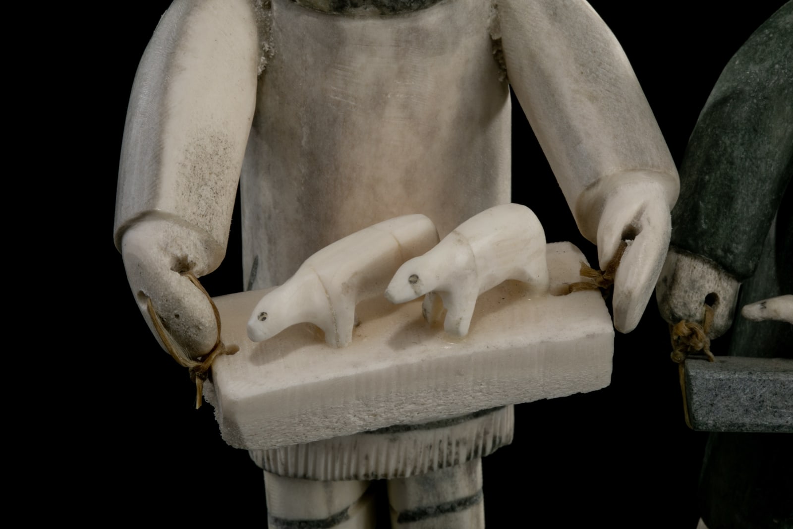 ROMEO EEKERKIK (1923-1983) ARVIAT (ESKIMO POINT), Four Inuit Bringing their Works to the Co-Op, 1975