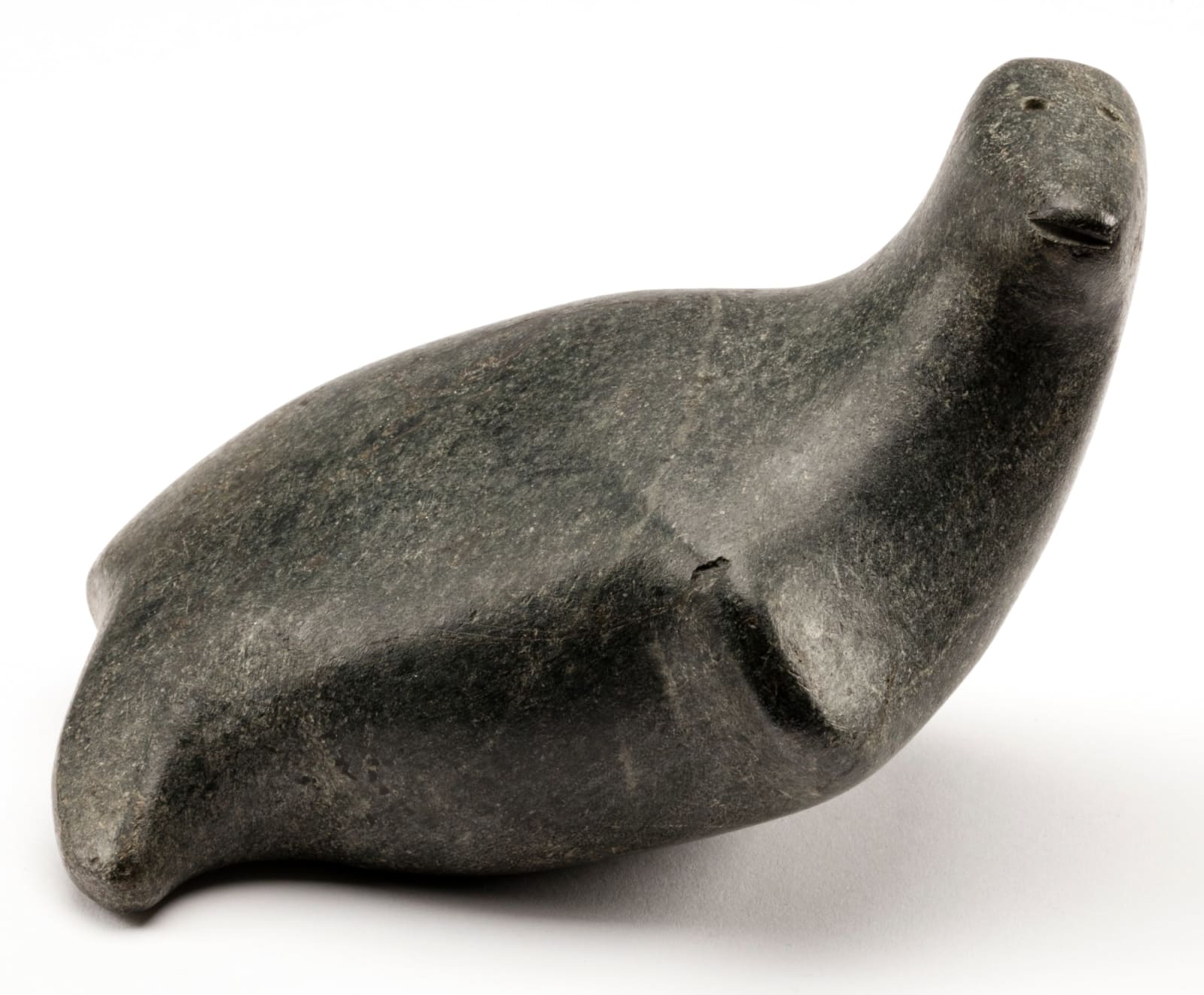 ANDY MIKI (1918-1983) ARVIAT/TIKIRAQJUAQ (ESKIMO POINT/WHALE COVE), Resting Seal, c. 1965-68